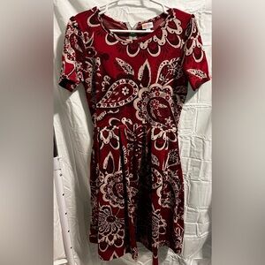 Lularoe Amelia. Red, burgundy, cream large paisley flowered pattern